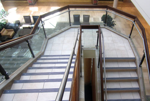 Quarter-turn concrete staircase with solid wood steps