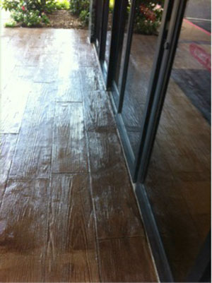 The warmth of wood and the durability of concrete provide a safe entrance to a busy hotel lobby.