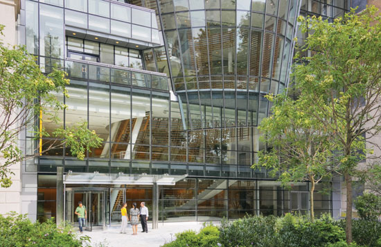 A stair designed to foster interdisciplinary collaboration is located within a central atrium of the Rockefeller University Building.