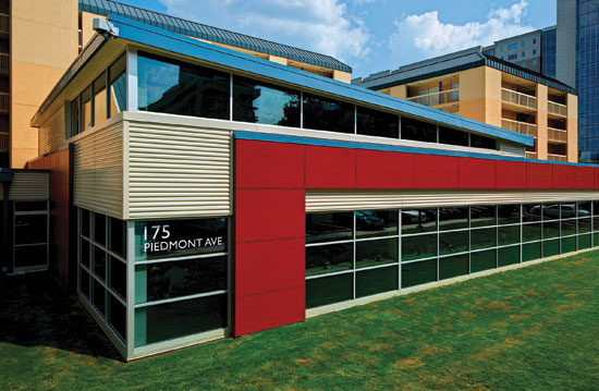 Horizontal metal wall panels in a metallic color are integrated with the rest of a building facade at Georgia State University.