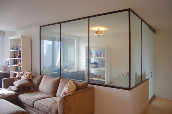 Looking toward the room from inside the main living space, this image shows the glass walls with one side “on” and one side “off.”