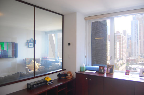 Inside the room, with the white glass walls set to opaque, enough privacy is created for a guest to feel comfortable in the space. When no guest is visiting, or if the space transforms to a nursery and the parents want to keep an eye on the baby, the windows can be switched to clear.