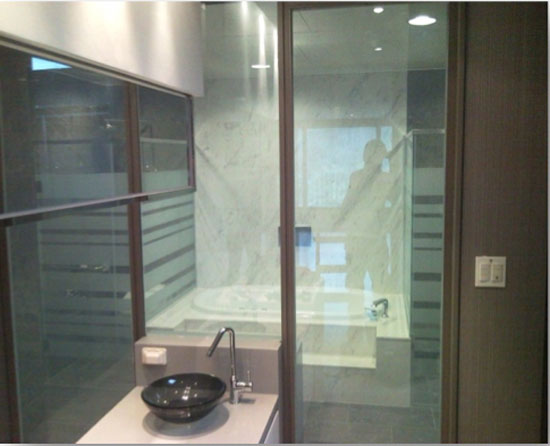 With PDLC smart glass, sections of a bathroom can have privacy or openness as needed, without blocking all the natural light.