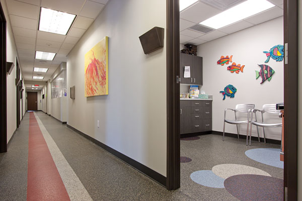 Healthy Outlook Family Medicine, P.C., located in Phoenix, Arizona. Studies indicate that the attractiveness of the surrounding, as in this exam room with recycled rubber flooring, has a positive impact on patient perceptions about quality of care. 