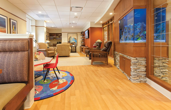 St. Mary’s Hospital, Madison, Wisconsin. During renovation and the building of a new wing, carpet was removed throughout hallways and patient rooms, and replaced with 60,000 square feet of a no-wax sheet vinyl product providing the look of wood with an advanced lifetime no-wax finish. St. Mary’s combines many different specialized areas. Shown here, the Ronald MacDonald Family Room, designed as a place of respite for families of critically ill children in the nearby pediatric and neonatal intensive care units, has been designed to be especially quiet, home-like, and reassuring.