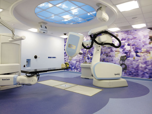 Cyberknife treatment room at Queen Elizabeth Hospital in Birmingham, UK. The striking color and design of the PUR-coated homogenous no-wax vinyl flooring bring positive energy into a potentially stressful experience.
