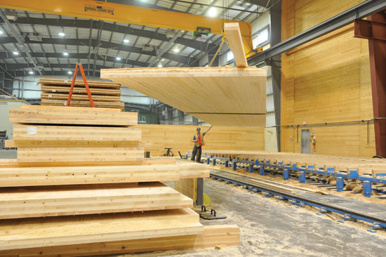 To manufacture CLT, several layers of kiln-dried lumber boards are stacked in alternating directions and bonded with structural adhesives to form solid, straight, rectangular panels.