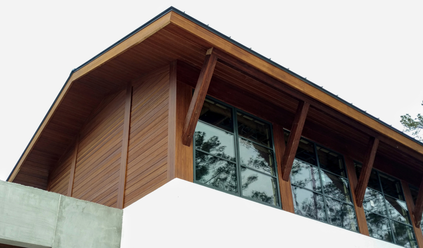 Engineered bamboo products used as rainscreen and structural supports for the overhang