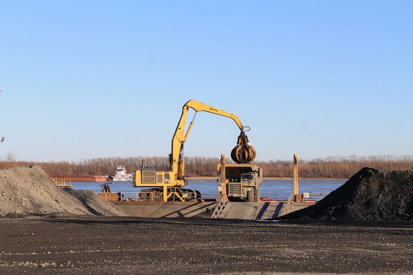 Shown is scrap being transferred from a barge to the scrap yard at Nucor-Yamato steel’s (NYS) mill facility.