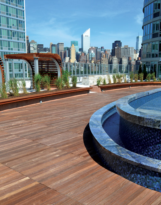 This large “neighborhood park” is five stories above the ground in this apartment complex at 4545 Center Boulevard, Long Island City, New York. A modular, pedestal deck system allowed for the installation of an entertainment center, outdoor barbecue, putting green, playground, and gardens.
