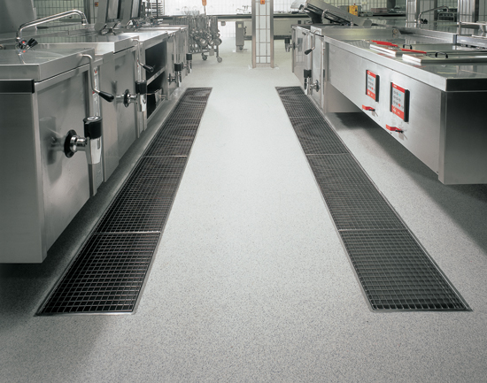 Stainless steel channels can be installed on most flooring types and work well in kitchens where there can be a high concentration of fats, chemicals, and high heat.