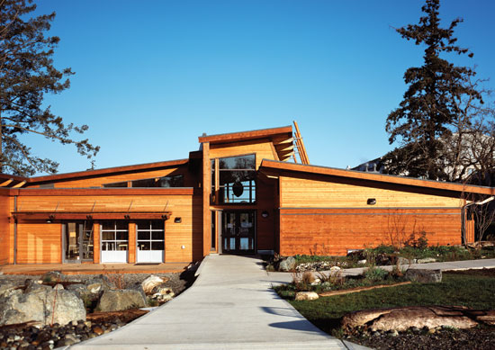 For students on the South Saanich Indian Reserve on Vancouver Island, an addition to Saanich Indian School Board (SISB) is clad in Western Red Cedar siding and trims with posts and landscape elements.