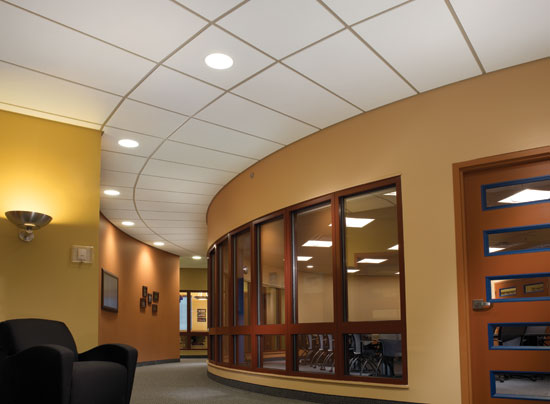 Traditional acoustic ceiling panels are available in more shapes and sizes, including shapes appropriate for ceilings radiating out from a circular center.