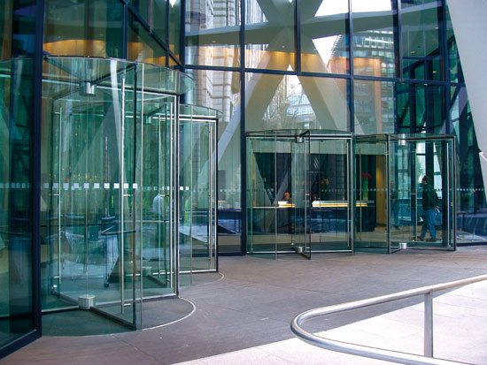 All-glass revolving doors are well-suited for a glass facade.