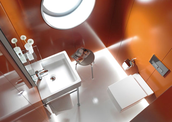 A wall-mounted washbasin and toilet maximize space while maintaining aesthetic integrity.