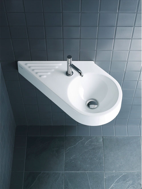 This sleek hand rinse basin has an angular diagonal shape to maximize use of tight, irregular spaces