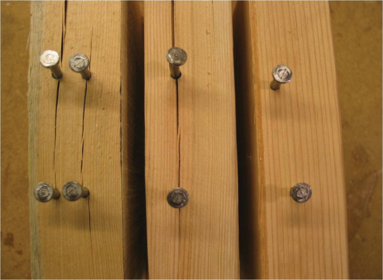 Nail spacing is important. If splitting occurs, it will always occur parallel to the grain and not perpendicular to grain, no matter how close the nails are spaced along this axis. Staggering a line of nails when closely spaced, minimizes potential splitting along the length of the member. In a tightly nailed shear wall, staggered nailing helps prevent splitting of framing members and allows higher loads to be transferred.