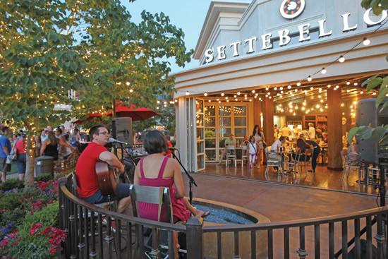 An outdoor stage and additional seating areas were created by the installation of an opening glass wall at Settebello Restaurant, Station Park, Farmington, Utah.