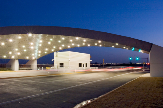 The Lockheed-Martin Security Entrance Gate in Fort Worth, Texas, is trapezoid in plan and has a surface area of approximately 9,175 square feet. To minimize materials, a rectangle was divided in half with the larger side of the trapezoid at the entrance to the security gate.