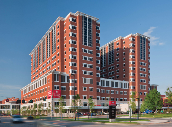 The precast included several different finishes with five colors of thin brick, producing a range of color that is common to the handset-brick and stone used on adjoining buildings.