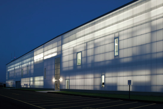 The Volo Aviation hangar at Sikorsky Memorial Airport in Stratford, Conn., designed by Beinfield Architecture, uses a full-height translucent polycarbonate facade to provide insulation as well as daylighting within the large technical facility.