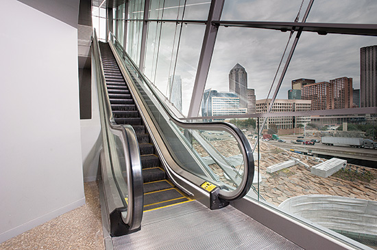 This glass enclosed escalator in Dallas, Texas quickly and efficiently moves people through the building but also provides daylight and a positive experience for the people using it.