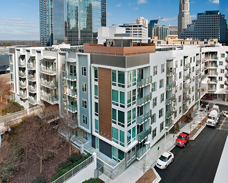 At Crescent Terminus in Atlanta, stairs are designed with double stud walls providing a 2-hour fire separation. The team specified concrete block construction at the elevator shafts, and used a wood-frame wall to separate the elevator shaft from the rest of the construction. They also filled the interstitial space between floors with blown insulation instead of using sprinklers, which avoided technical concerns related to having sprinklers in inaccessible spaces.