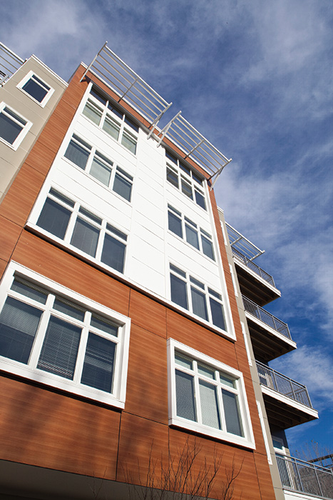 Vox on Two in Cambridge, Massachusetts, includes four stories of Type VA wood-frame construction over a Type IA concrete podium. A 3-hour fire-resistance rated horizontal assembly separates the wood-frame residential portion from the concrete garage. Fire walls were also used to divide the wood-frame portion of the structure into four separate buildings for the purpose of determining allowable height and area. (See Fire Walls on page 5.) A project of Criterion Development Partners, the 335,500-square-foot structure was completed in 2014 for a construction cost of $46.6 million.