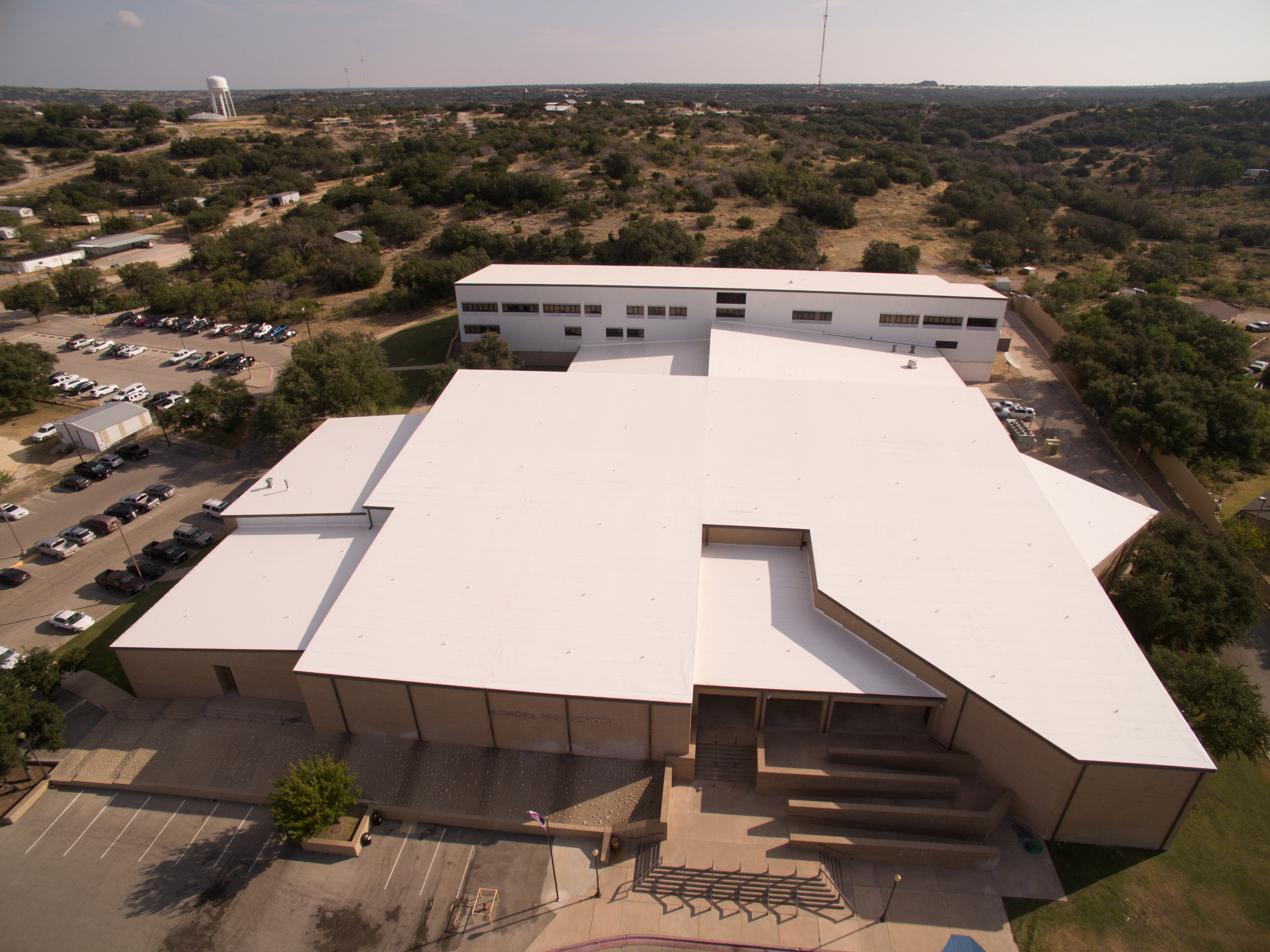 There is a long-debunked perception that vinyl is harmful to building occupants. It is not. And its clean installation is considered safer than roofing systems involving tar and hot pots. A vinyl roof was installed on Tulia High School in Tulia, Texas.
