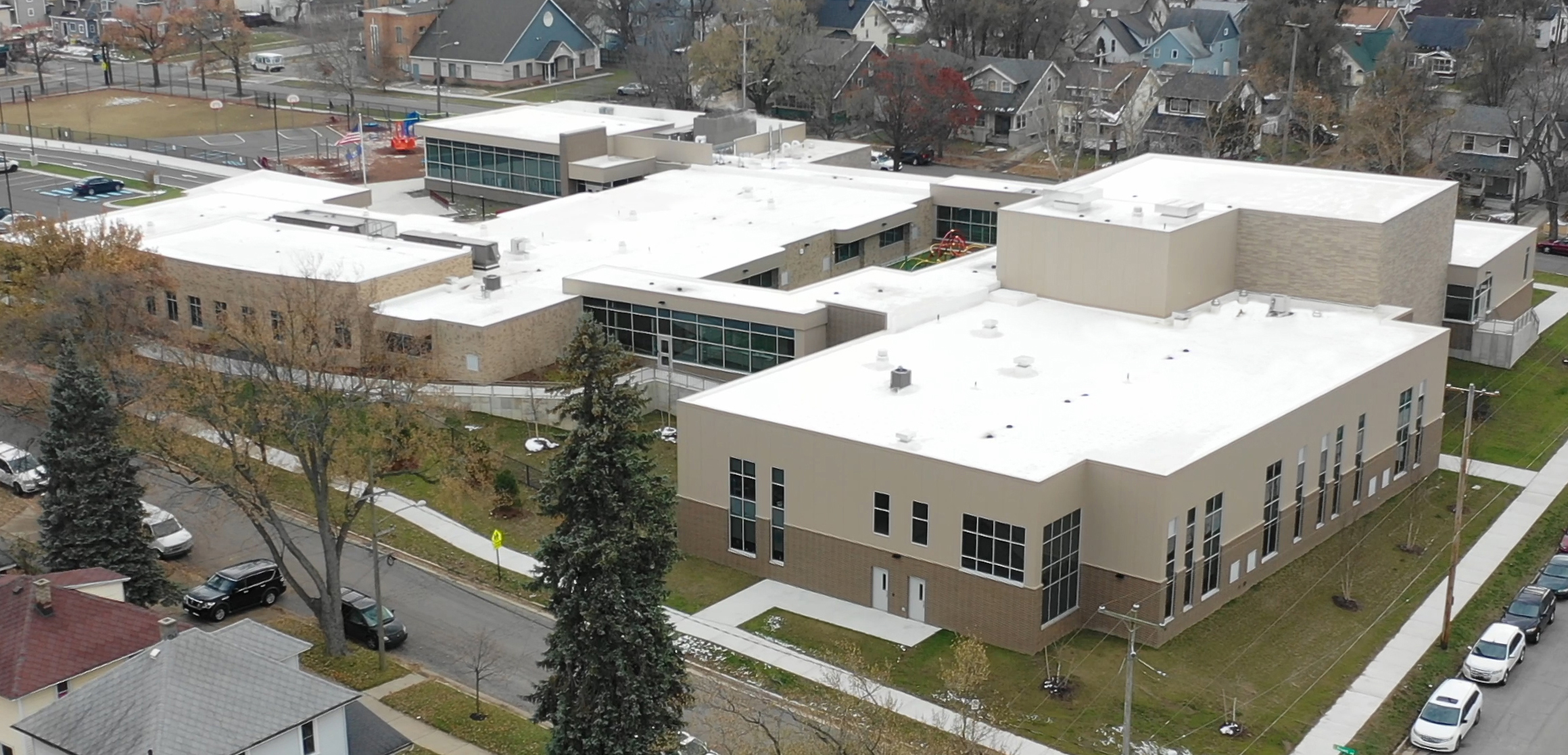 Studies show that cool roofing systems provide energy savings and other benefits when installed in cold climates. This cool roof was installed on West Shore Elementary School in Fenton, Michigan.