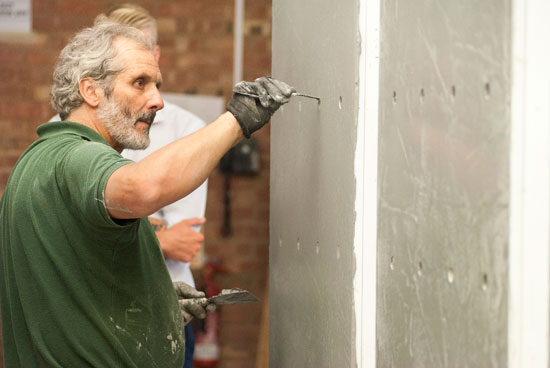 Modular plaster panels are fabricated in a central location using skilled craftsmen avoiding the need to find local plasterers.