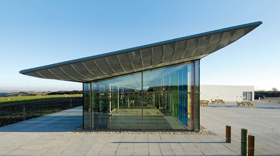 The British firm Architype designed an airport visitor center in England using a robust post-and-rail façade with triple glazing to allow copious daylight into the interior while controlling thermal loss and gain.