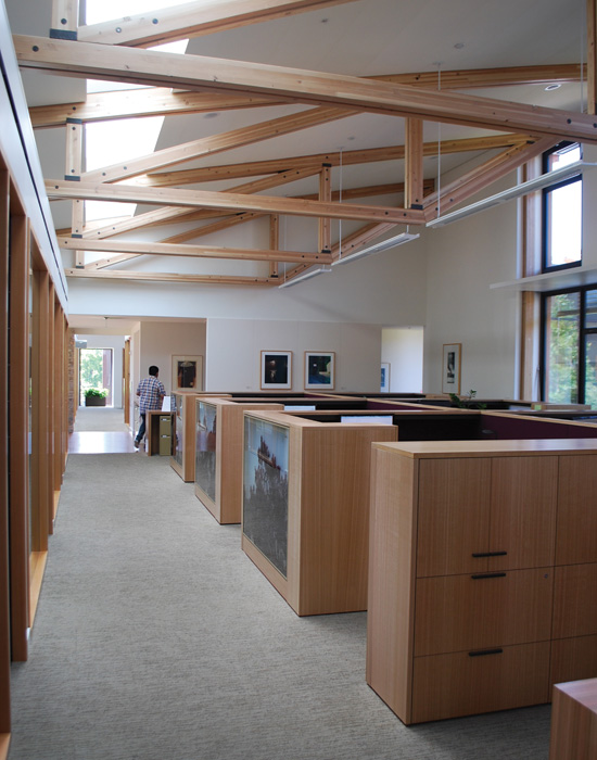 Occupants of the David & Lucile Packard Foundation headquarters are in constant contact with nature, indoors and out. Wood is the main exterior cladding material of the LEED Platinum building (top), and features prominently in the interiors (bottom), with extensive views of the outdoor courtyard.