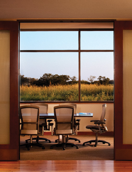 Research is confirming that interiors with natural materials and views, exemplified here in the Greater Texas Foundation in Bryan, Texas, can lower stress and promote relaxation.