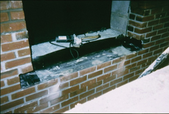 Correct flashing detail at a window opening showing end dams.