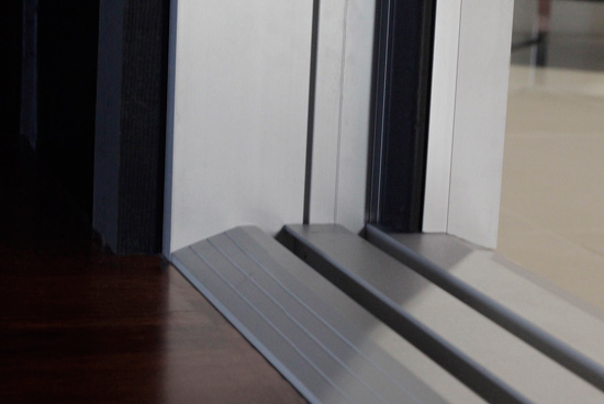 Recently an ADA-compliant ramp for folding doors has become available.