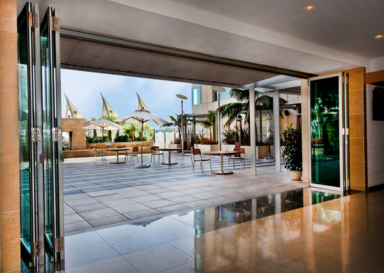At the Omni Hotel, sleek aluminum framed folding glass doors bring the outside in, and create a feeling of luxurious spaciousness.