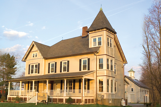 Exterior of the historic bed and breakfast that received dozens of new vinyl-clad windows with an Argon gas fill, low-E coated glass, and special thermally broken frames. 