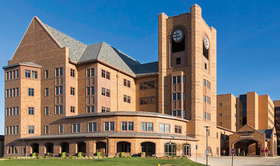 The Sanford Heart Hospital uses precast concrete panels embedded with thin brick to create a very detailed, yet traditional facade. Precast panels include arches and many unique pieces along with integration of exposed precast concrete sills, trim, and banding.