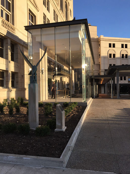 At the 100-year-old Detroit Athletic Club, steel framing creates an elegant and transparent glass entrance vestibule.