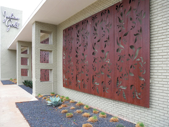 Use patterned architectural panels to update an existing façade or to camouflage structural supports.