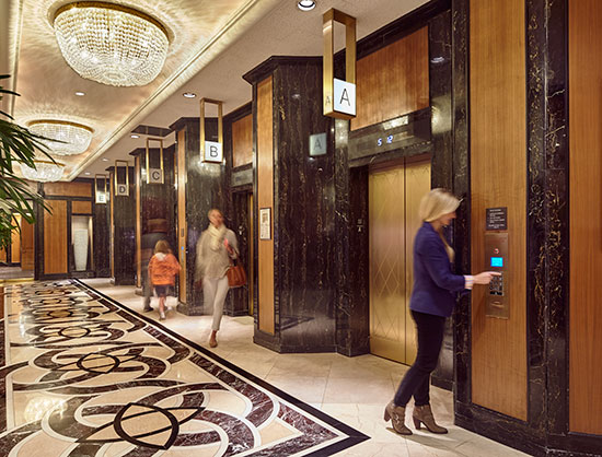 After passengers enter their floor destination, the screen will indicate which elevator to take.