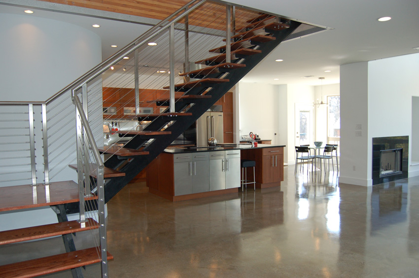 Photo of a staircase with stainless steel posts.