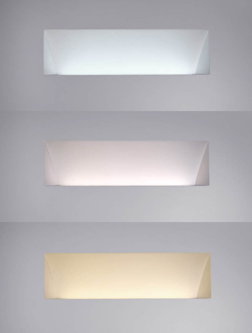 Photo of three wall-recessed, uplight luminaires.