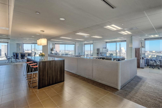 At Fortis Commercial Construction in Dallas, sliding glass doors enable daylight and views to penetrate deep into the interior space. 