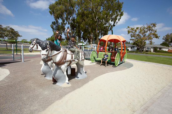 Children play on the custom playground that reflects the classic Walt Disney film “Cinderella.”