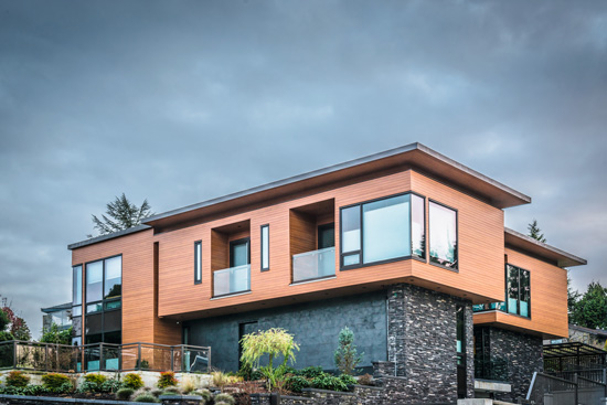  A house with stone and woodgrain siding can have positive effects on the occupants because the materials help connect people with nature and provide comfortable and productive places, say experts in biophilic design.