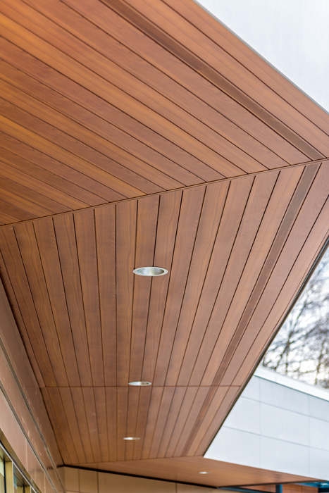 The wood-look aluminum soffit for Pemberton Plaza is rendered in a light cherry finish produced with a sublimation powder-coat process. 