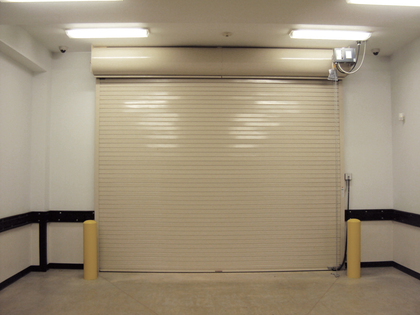 Insulated rolling steel doors are ideal for use in places with very low headroom, as seen from the internal view of this door in Amarillo, Texas.
