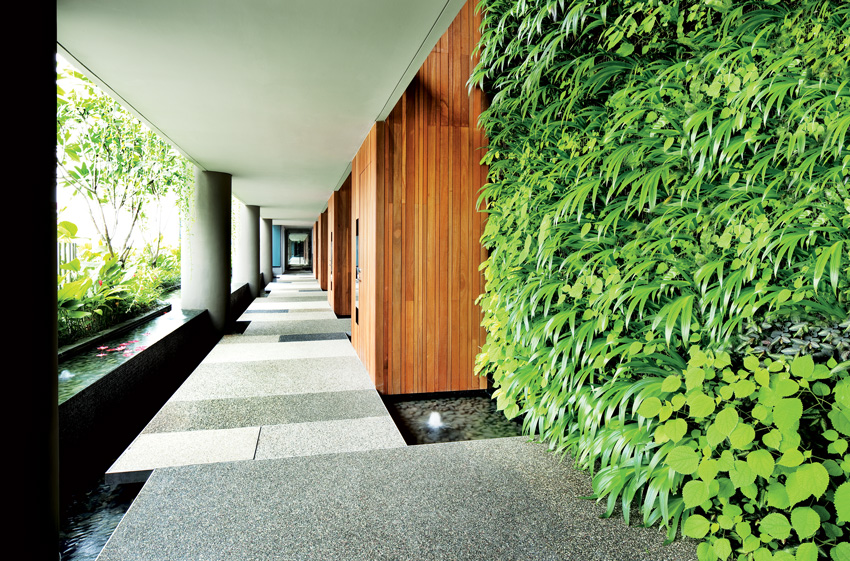 The gardens viewed from an outdoor corridor.